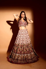 Maroon sleeveless choli with cream lehenga & heavy maroon dupatta