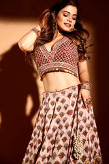 Maroon sleeveless choli with cream lehenga & heavy maroon dupatta