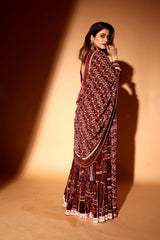 Wine color sharara with pink mirror dupatta.